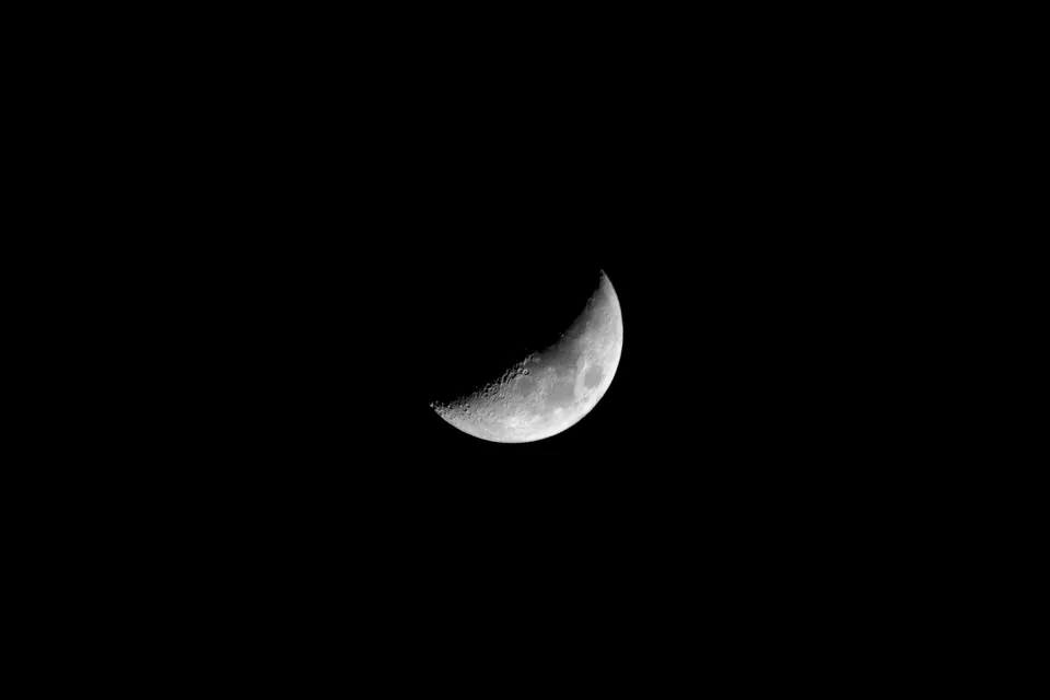 Crescent moon against a black sky