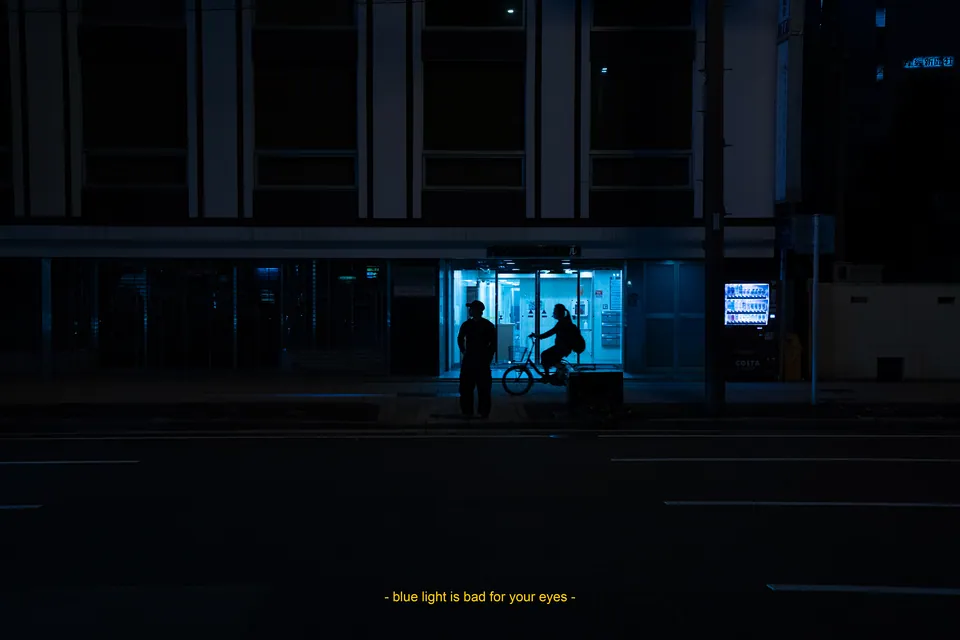 Lit shopfront at night on an otherwise dark street